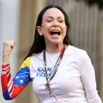 (FILES) Venezuelan opposition leader Maria Corina Machado gestures supporters during a protest called by the opposition on the eve of the presidential inauguration, in Caracas on January 9, 2025. Venezuela’s opposition leader Maria Corina Machado wins the 2025 Nobel Peace Prize, the Norwegian Nobel Committee announced on October 10, 2025. (Photo by Pedro MATTEY / AFP)
