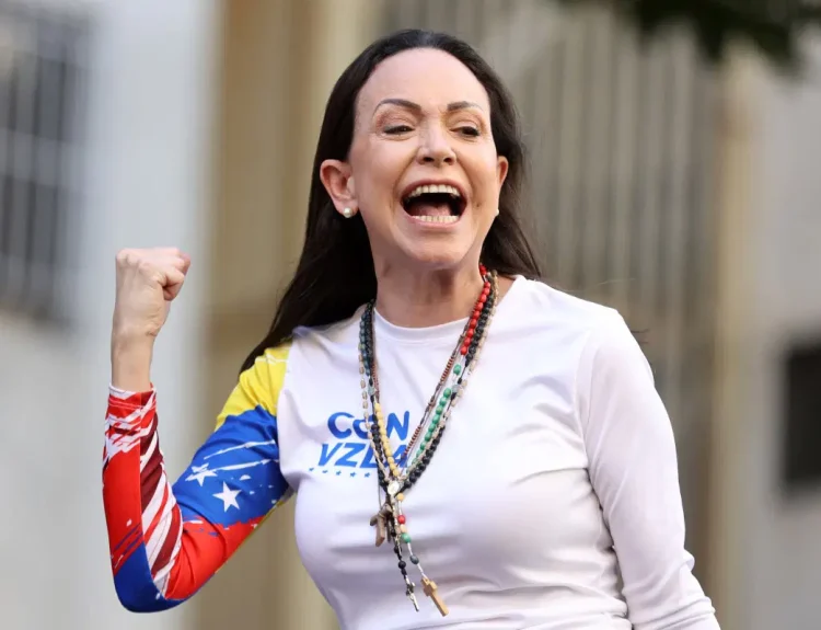 (FILES) Venezuelan opposition leader Maria Corina Machado gestures supporters during a protest called by the opposition on the eve of the presidential inauguration, in Caracas on January 9, 2025. Venezuela’s opposition leader Maria Corina Machado wins the 2025 Nobel Peace Prize, the Norwegian Nobel Committee announced on October 10, 2025. (Photo by Pedro MATTEY / AFP)